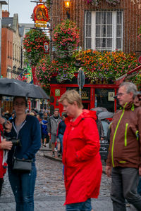 People walking on street in city