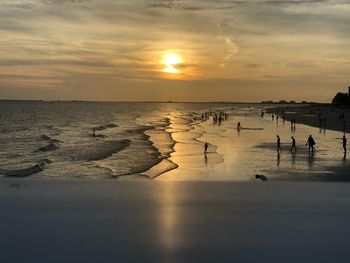 Sunset from pier, people watching 