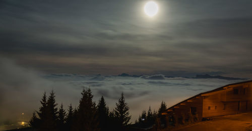 Scenic view of snowcapped mountains against sky at night