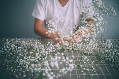 Close-up of hand holding flowers