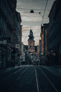 Street amidst buildings in city against sky