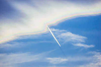 Low angle view of vapor trails in sky