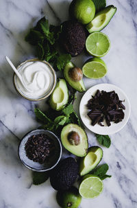 Limes and avocados, studio shot