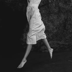 Low section of ballet dancer at beach