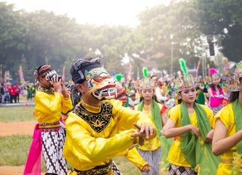 Group of people in traditional clothing during festival