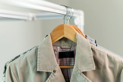 Close-up of clothes hanging on rack