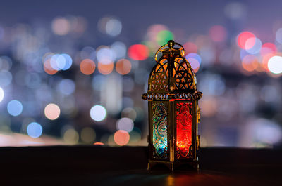 Lantern with city bokeh light background for the muslim feast of the holy month of ramadan kareem.