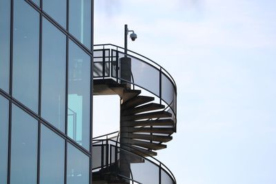 Low angle view of spiral staircase against sky