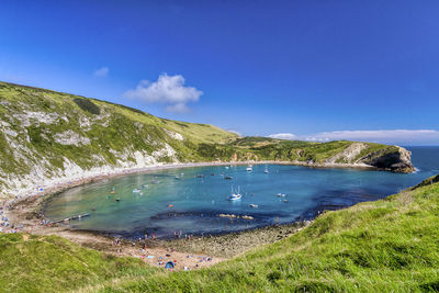 Scenic view of sea against blue sky