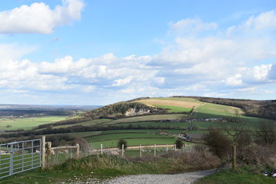 Scenic view of agricultural field against sky