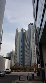 Modern buildings in city against sky