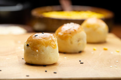 Chinese pastry filled with mung bean paste, taro, and salted egg in the paper box.