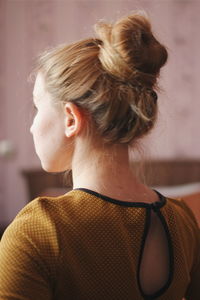 Rear view of young woman with blond hair