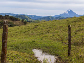 .the volcano arenal at la fortuna in costa rica. the volcano has a classic shape of a cone.