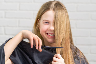 Close-up of young woman with blond hair