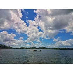 Scenic view of sea against cloudy sky