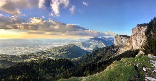 Panoramic view of landscape against cloudy sky