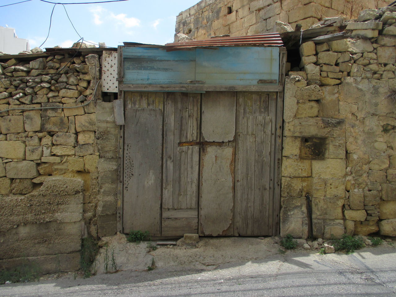 OLD WEATHERED WALL OF BUILDING