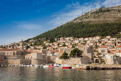 Buildings in town against sky