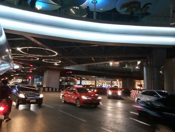 Cars on road in city at night