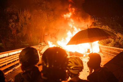 People during protest at night