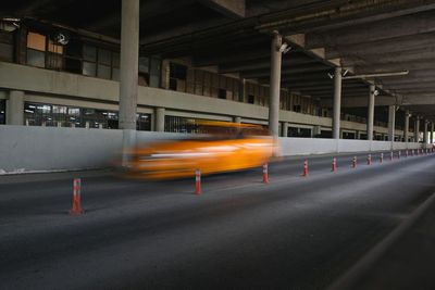 Blurred motion of car on road in city