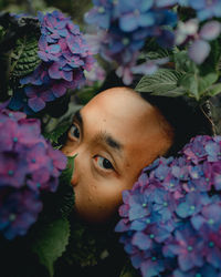 Portrait of young woman with flowers