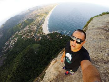 High angle view of man standing at pedra do elefante against sea