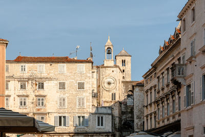 Buildings in city against sky