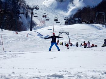 People skiing on snow covered mountain