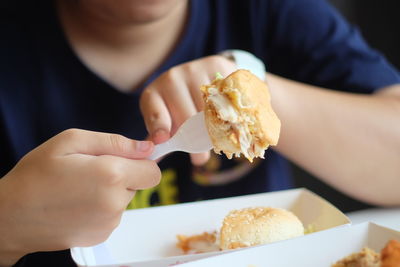 Close-up of man eating food