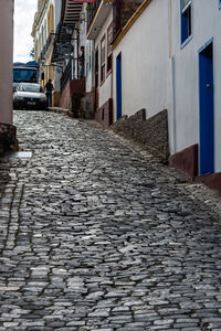 Surface level of footpath amidst buildings in city