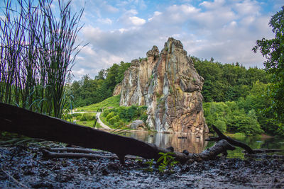 Panoramic view of rocks and trees against sky
