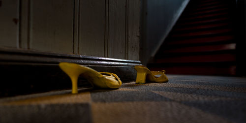 Close-up of yellow representation on wooden door