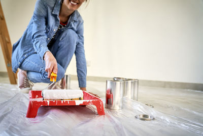 Low section of woman sitting on table