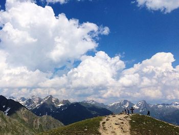 Scenic view of mountains against cloudy sky