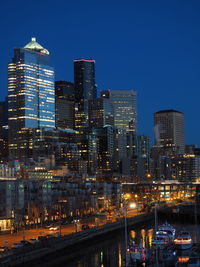 Illuminated buildings against sky in city at night