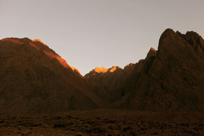 Scenic view of mountains against sky at sunset