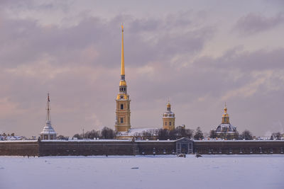 Tower of building against sky during winter