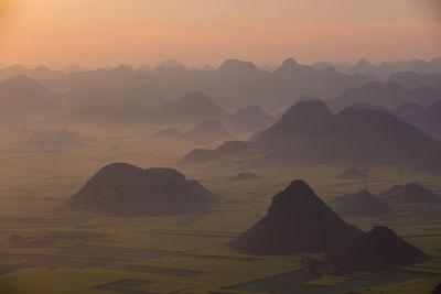 Scenic view of mountains against sky during sunset