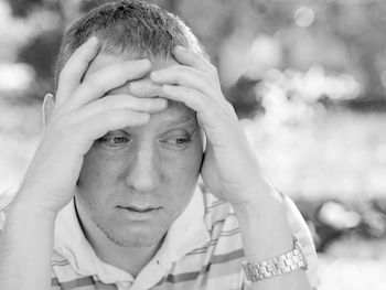 Close-up of sad man looking down