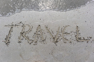 High angle view of footprints on sand