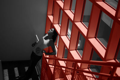 Low angle view of red telephone on wall