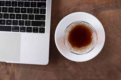 High angle view of coffee served on table