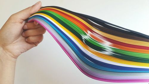 Close-up of multi colored object over white background