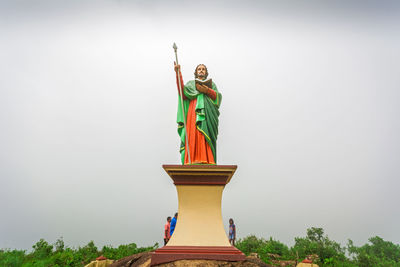 Low angle view of statue against sky