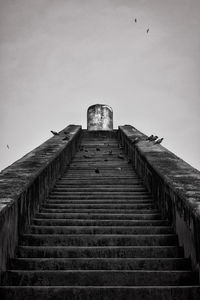 Low angle view of steps against clear sky