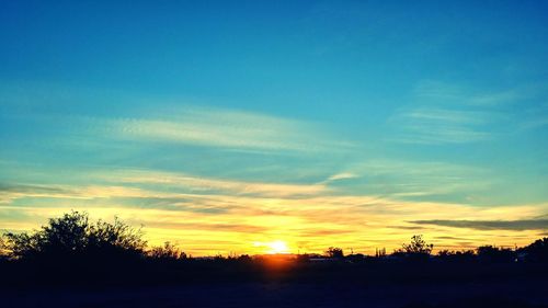 Scenic view of silhouette landscape against sky during sunset