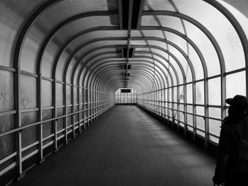 Man walking in illuminated corridor