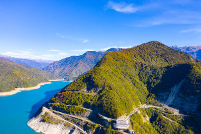 High angle view of mountains against blue sky